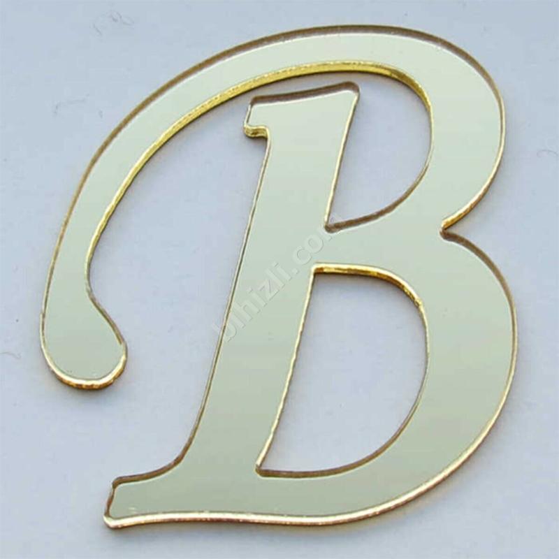 B harfi (altın renk)
